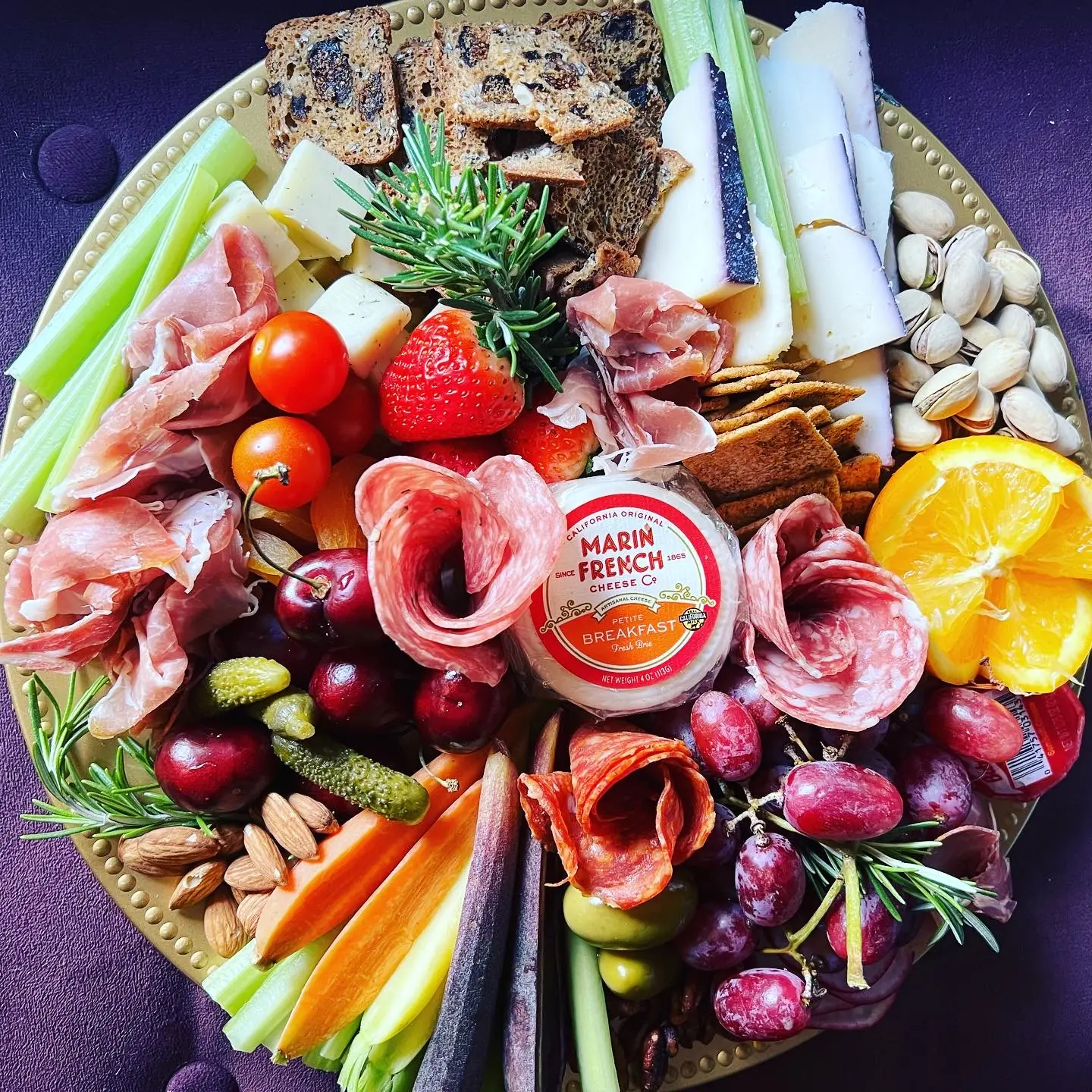 Shareable charcuterie and cheese platter with fruit and crackers