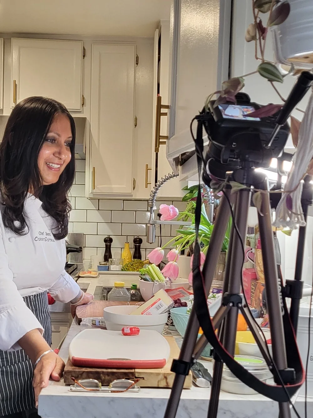 Chef Teena filming a virtual cooking session for corporate teams