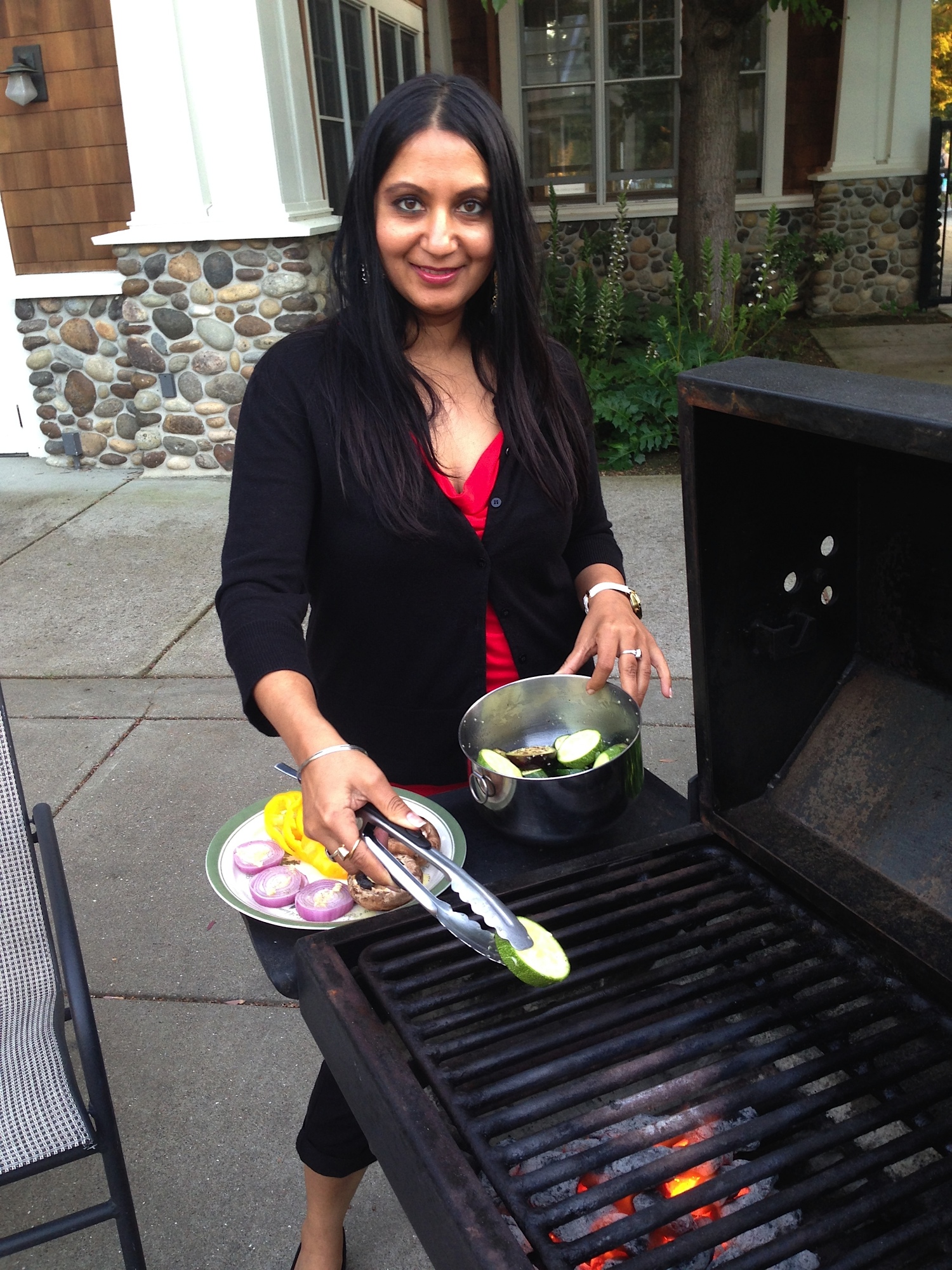 Chef Teena grilling vegetables outdoors