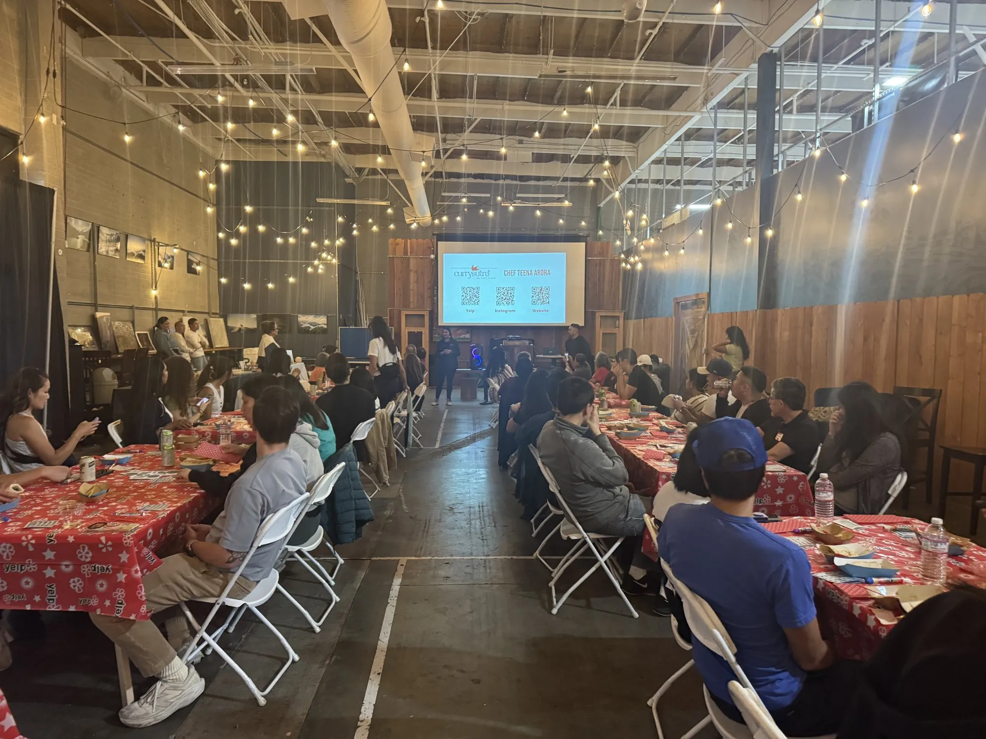 Chef leading a private wellness workshop presentation for a large group