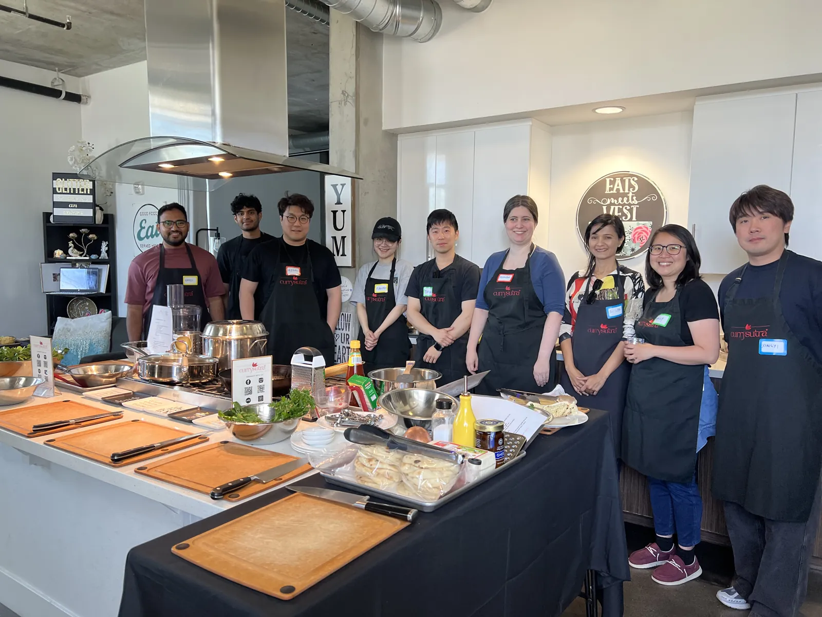Currysutra team cooking together at the Eats Meets West Bowls kitchen