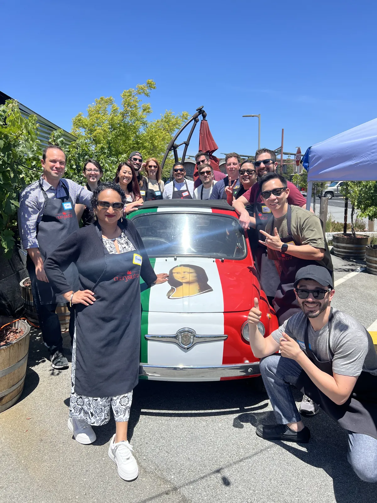 Currysutra team posing with a classic car at Auto Vino